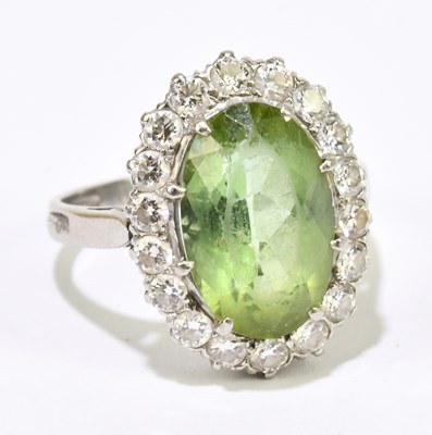 Lot 1014 - A platinum diamond and green peridot large...