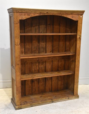 Lot 72 - A large pine open fronted bookcase, with...