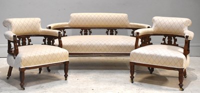 Lot 211 - A Victorian carved walnut three piece lounge...