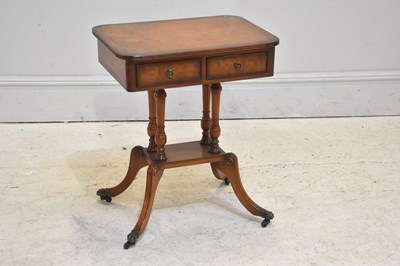 Lot 164 - A two drawer reproduction walnut side table,...