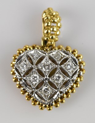 Lot 2056 - A yellow and white metal diamond set heart...