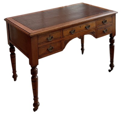Lot 50 - An Edwardian walnut leather inset top desk,...