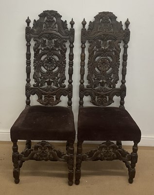Lot 841 - A pair of 19th century carved hall chairs with...