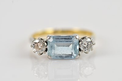 Lot 2296 - An 18ct yellow gold diamond and aquamarine...