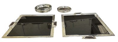 Lot 1119 - RICCI; a pair of Art Deco style silver plated...