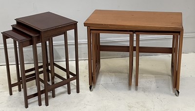 Lot 25 - A mid century teak nest of coffee tables, the...