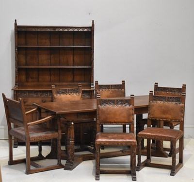 Lot 124 - A reproduction oak dining suite comprising...