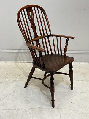Lot 81 - A 19th century elm seated Windsor elbow chair,...