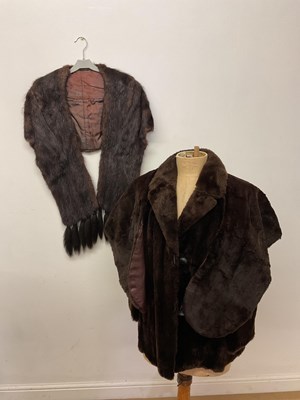 Lot 377 - A fur coat and two fur stoles (3). One stole...