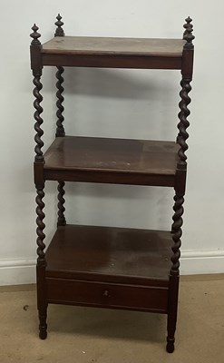 Lot 784 - A mahogany two tier what-not with undertier,...