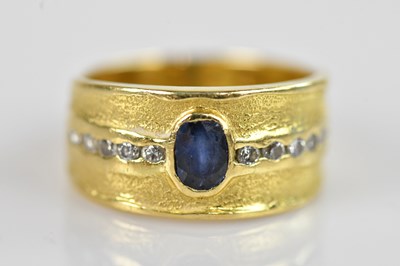 Lot 2495 - A yellow metal diamond and sapphire line ring,...