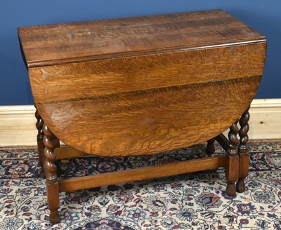 Lot 2921 - A 1930's oak gateleg table, height 72cm,...