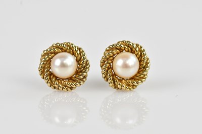 Lot 1431 - A pair of yellow metal and pearl set ear studs,...