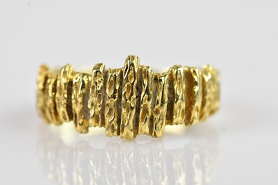 Lot 2345 - An 18ct yellow gold modernist textured ring,...