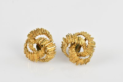 Lot 1428 - A pair of 9ct yellow gold modernist ear studs,...