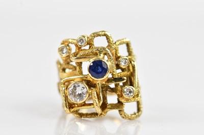Lot 2294 - A modernist yellow metal diamond and sapphire...