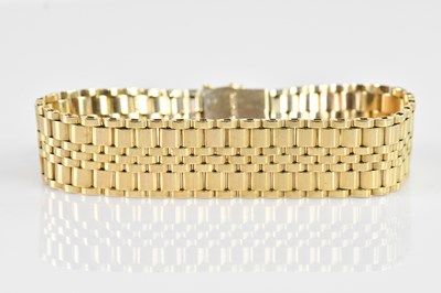 Lot 1151 - A 9ct yellow gold flat link bracelet, length...