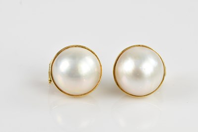 Lot 1429 - A pair of yellow metal mabe pearl ear studs,...