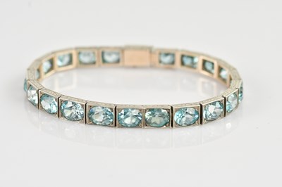 Lot 1252 - A 1920s white metal and blue topaz set...