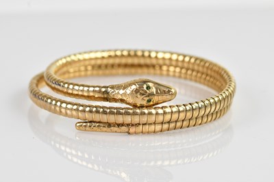 Lot 1174 - A 9ct yellow gold sprung serpent bracelet, set...