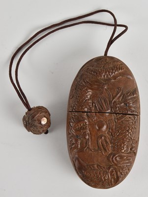 Lot 1073 - A late 19th/early 20th century Japanese carved...