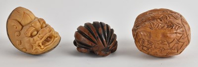Lot 1078 - A Japanese carved walnut, decorated with...