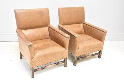 Lot 127 - A pair of oak framed leather upholstered elbow...