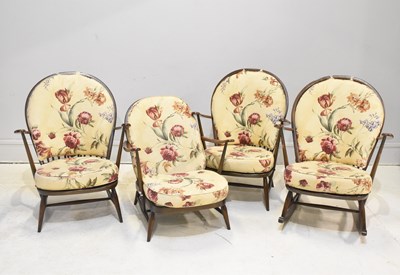 Lot 18 - ERCOL; a dark elm three piece lounge suite of...