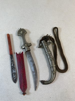 Lot 345 - An Eastern curved dagger in metal scabbard,...