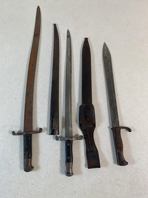 Lot 284 - Three bayonets, two in scabbards, the longest...