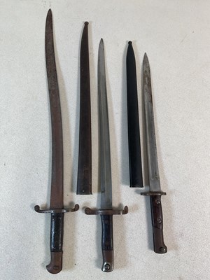 Lot 285 - Three bayonets, two in scabbards, the longest...