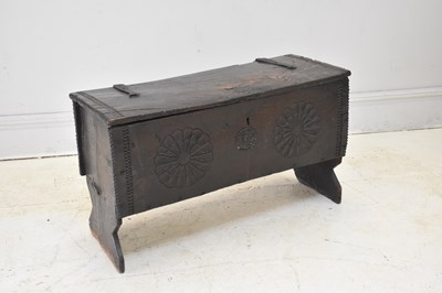 Lot 186 - A 17th century carved oak six plank coffer,...