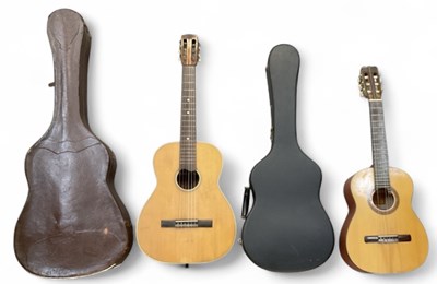 Lot 399 - Two cased modern acoustic guitars, comprising...