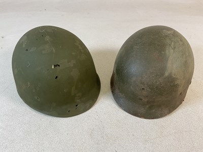 Lot 332 - A pair of WWII American army helmet liners,...