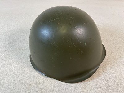 Lot 300 - A WWII Russian infantry helmet, with liner...