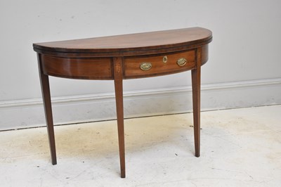 Lot 193 - A George III inlaid mahogany fold-over tea...