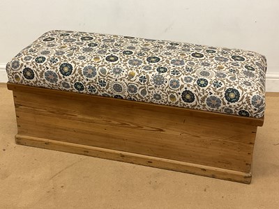 Lot 790 - An upholstered pine chest with metal handles,...