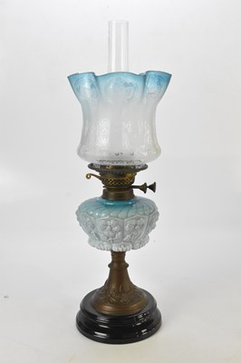 Lot 2044 - A blue glass and brass oil lamp, height 59cm.