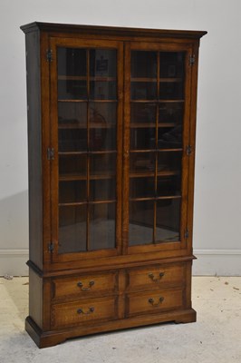 Lot 142 - A reproduction mahogany bookcase with two...