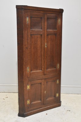 Lot 235 - An 18th century oak freestanding corner...