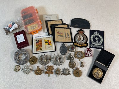 Lot 308 - A group of cap badges including a Prussian...