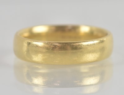 Lot 1307 - An 18ct gold band, size Q, approx 6.8g.