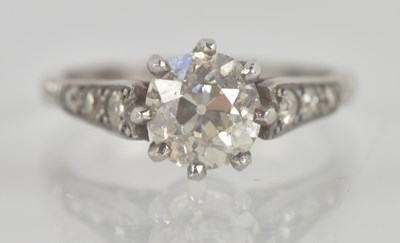 Lot 1291 - A platinum and diamond set ring, the claw set...