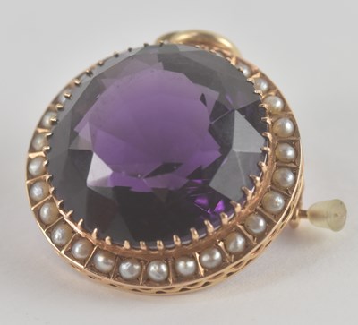 Lot 1442 - A 9ct yellow gold circular amethyst set brooch...
