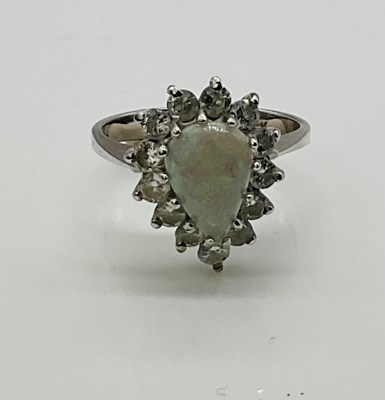 Lot 601 - A 14ct white gold opal and diamond pear shaped...