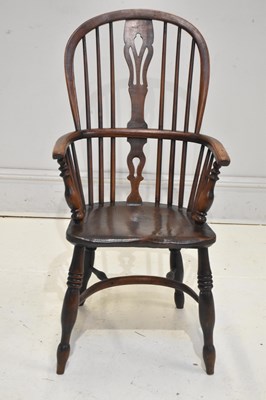 Lot 236 - A 19th century ash and elm seated Windsor...