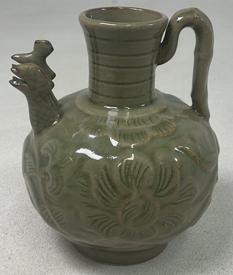 Lot 410 - A Yaozhou ware celadon ewer, decorated with...