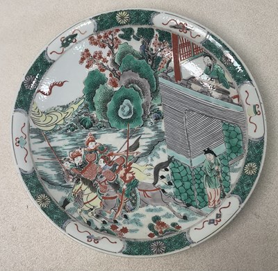 Lot 405 - A Chinese Famille Verte charger, with painted...