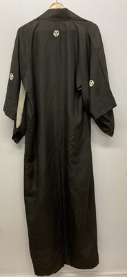 Lot 415 - A Japanese silk kimono, sparsely decorated...