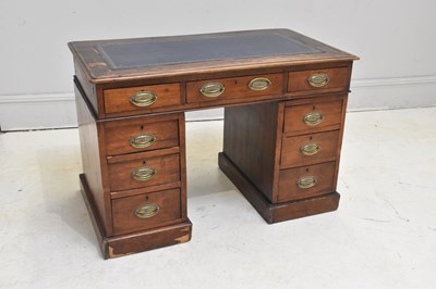 Lot 285 - A Victorian walnut nine drawer pedestal desk...